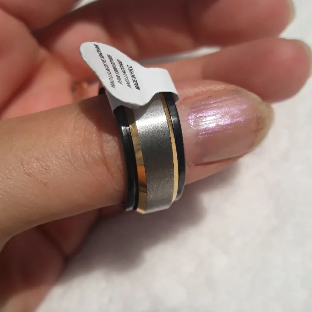 Gold, silver, and black men's spinner ring size 11.5